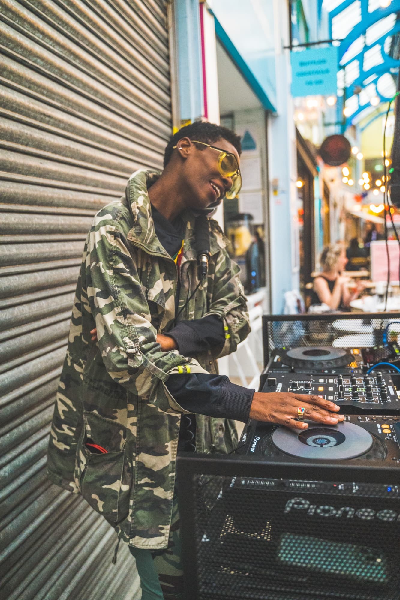 A DJ playing in Brixton Village — colour, sound, the texture of the place